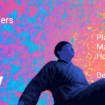 man floating with colorful background